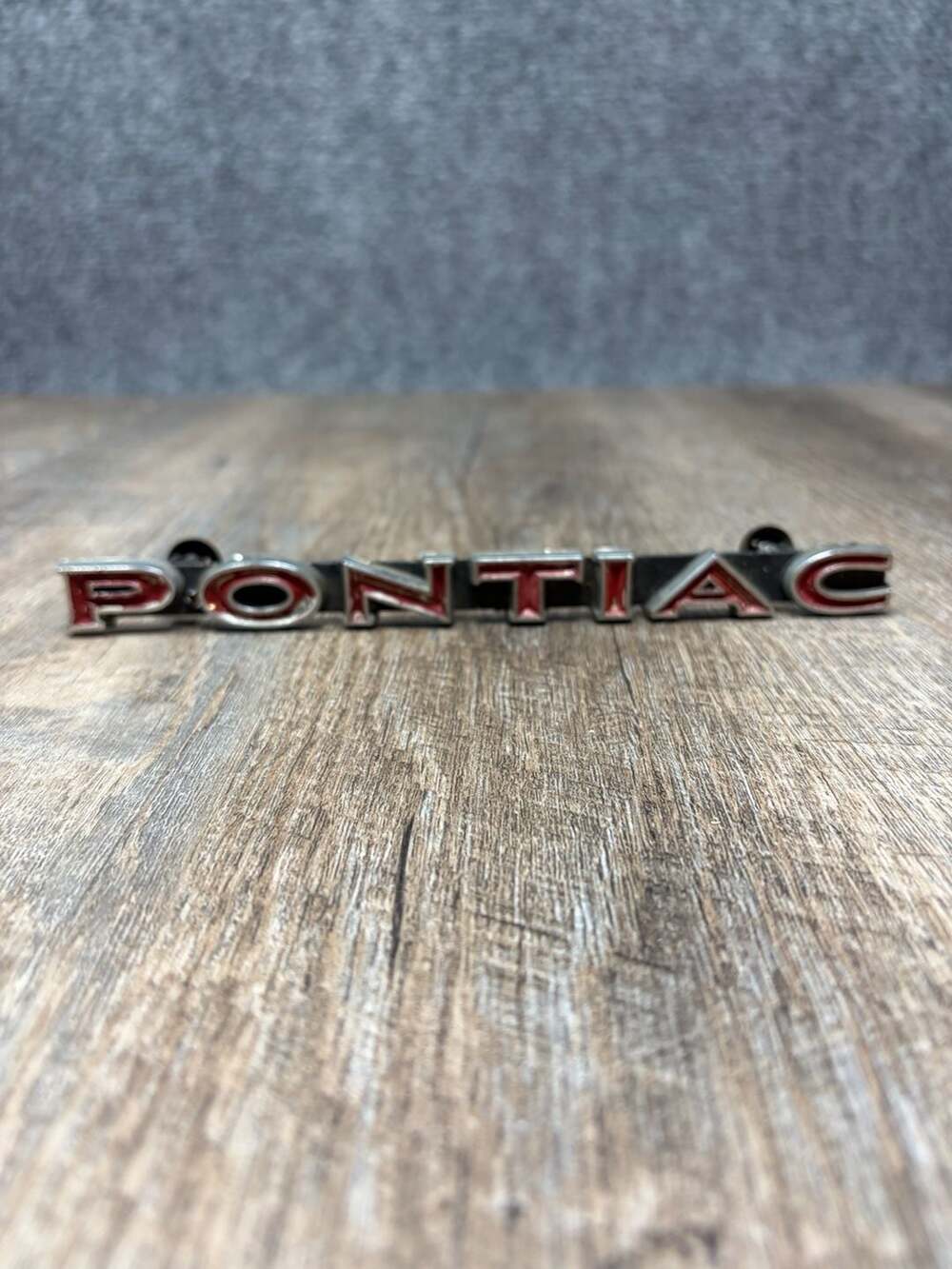 OEM 1970-71 PONTIAC LEMANS/TEMPEST ORIGINAL GRILL EMBLEM #477741 color red